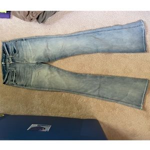 A pocket 7 for all mankind light wash jeans